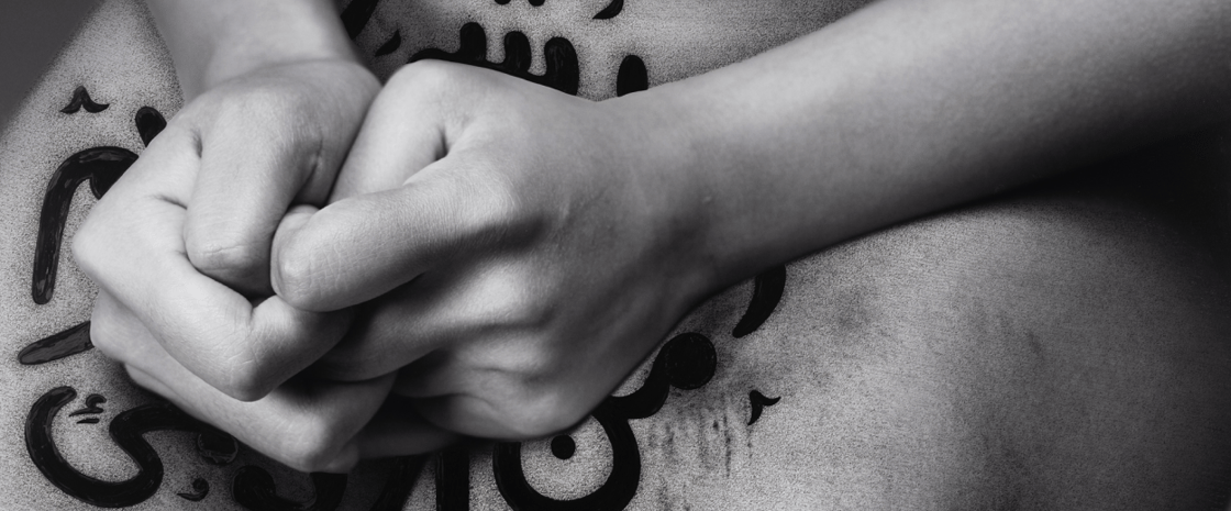 a close-up shot of two hands on the person's lap.